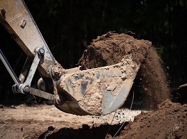 excavator claw digging out dirt