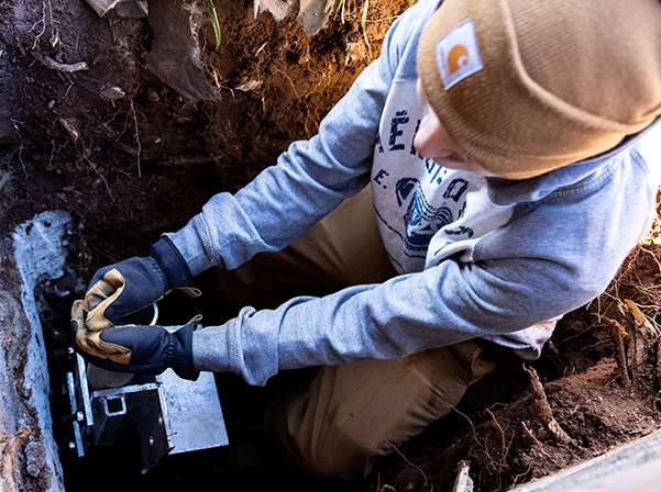 man repairing foundation