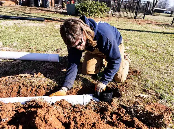 person working with pipe