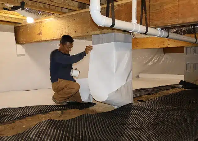 man working in crawl space